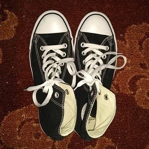 Black and white hightop Converse